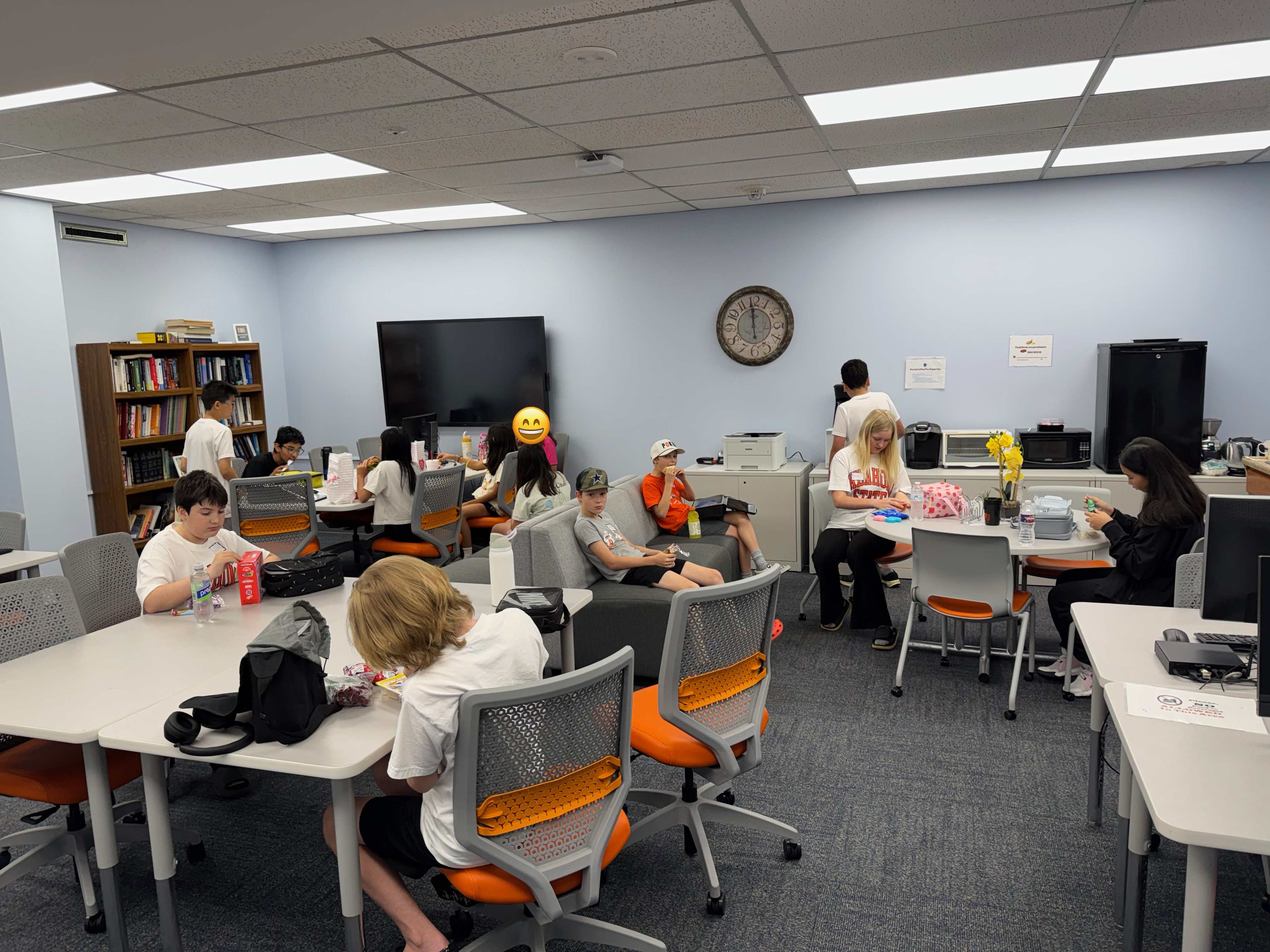 Student in a classroom actively engaged in a class activity.