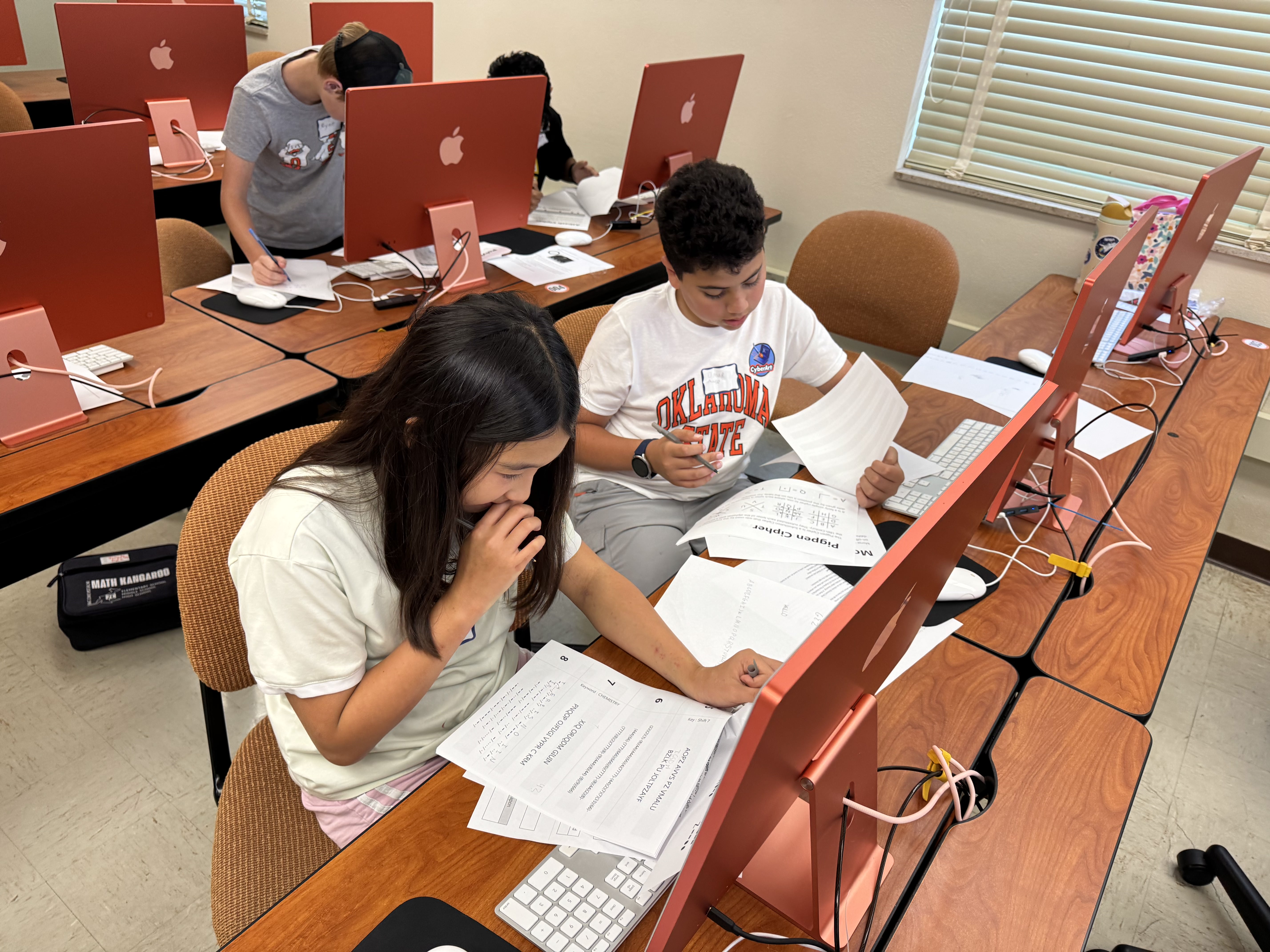 Student in a classroom actively engaged in a class activity.