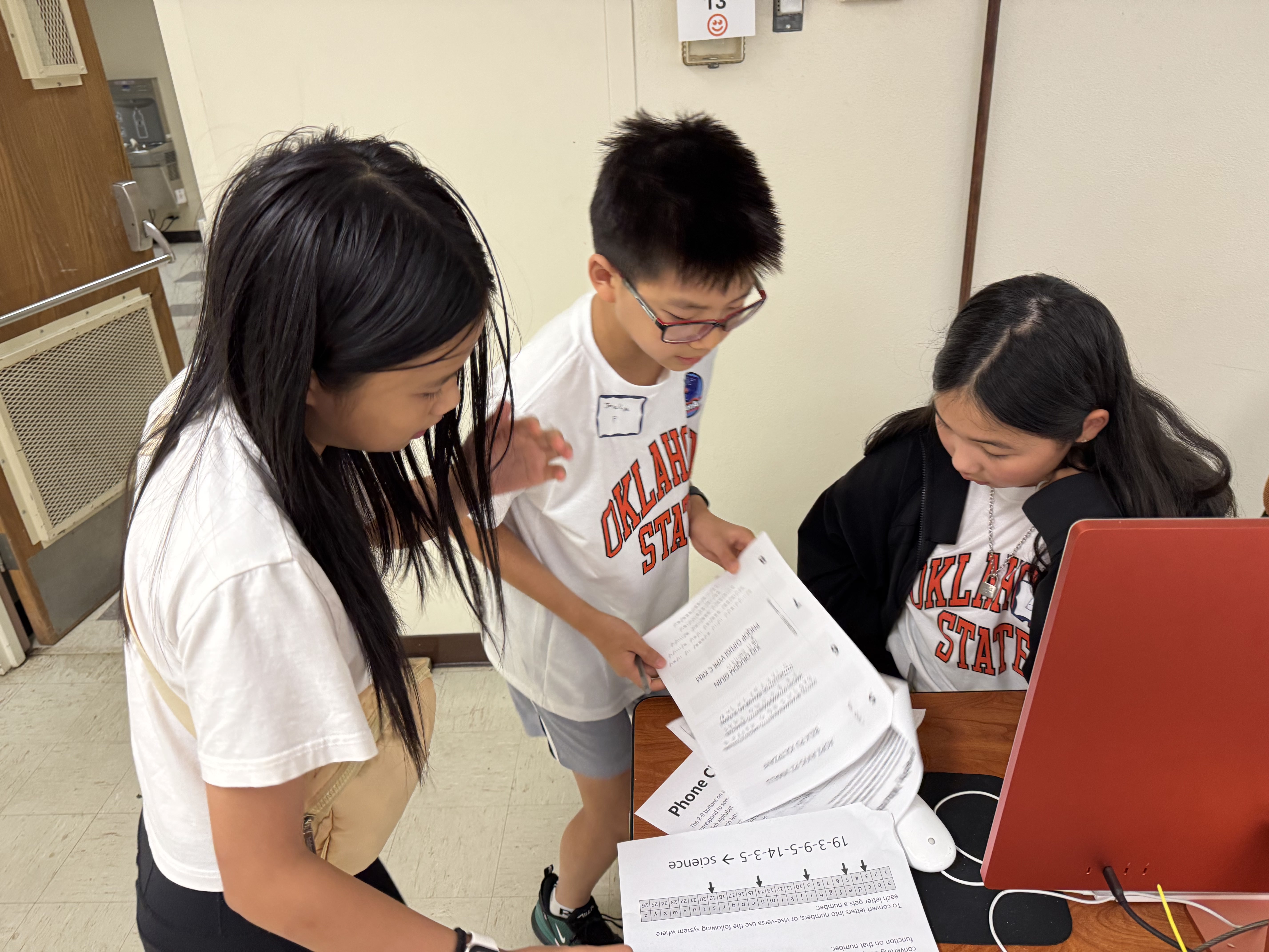 Student in a classroom actively engaged in a class activity.