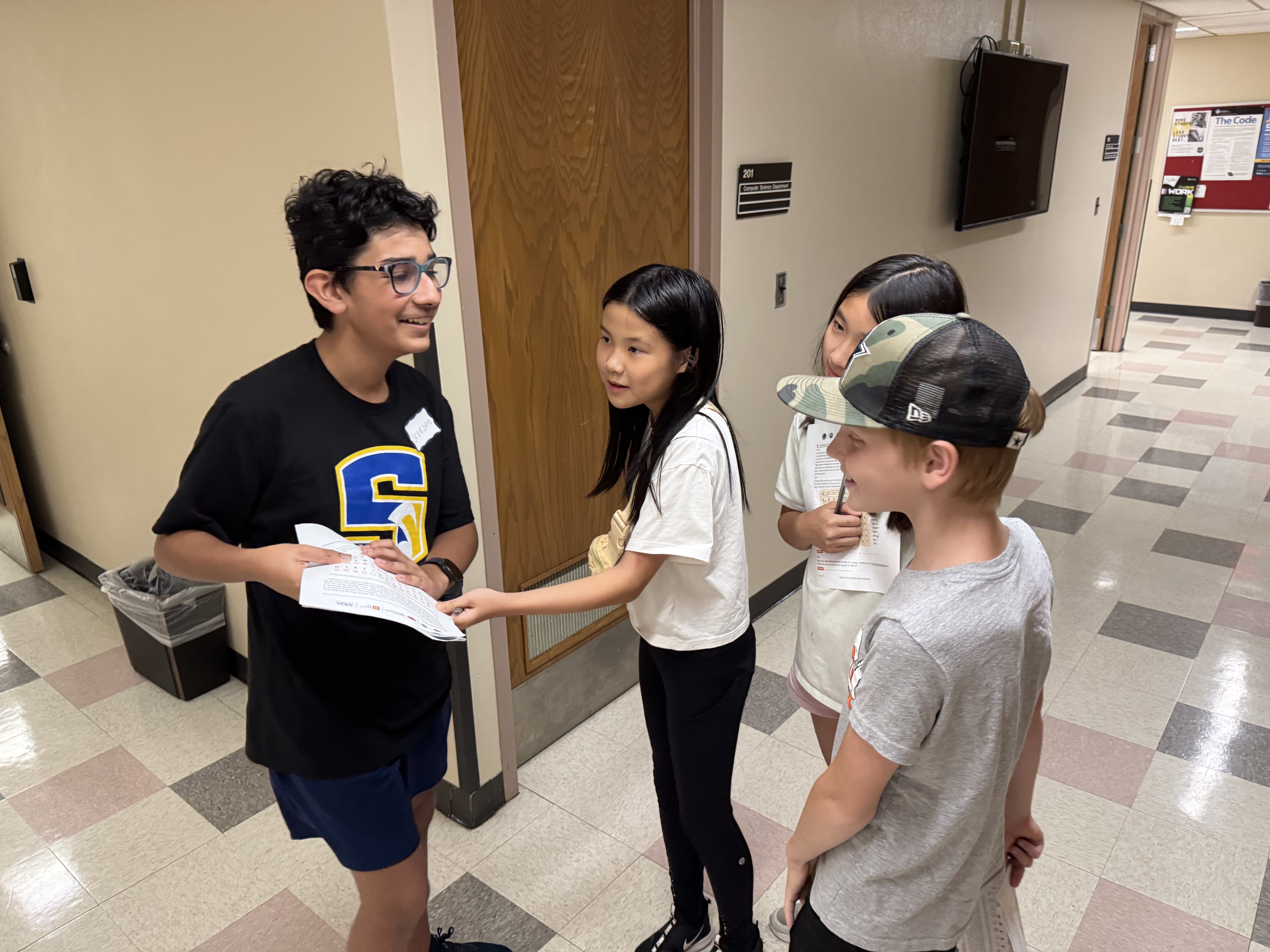 Student in a classroom actively engaged in a class activity.