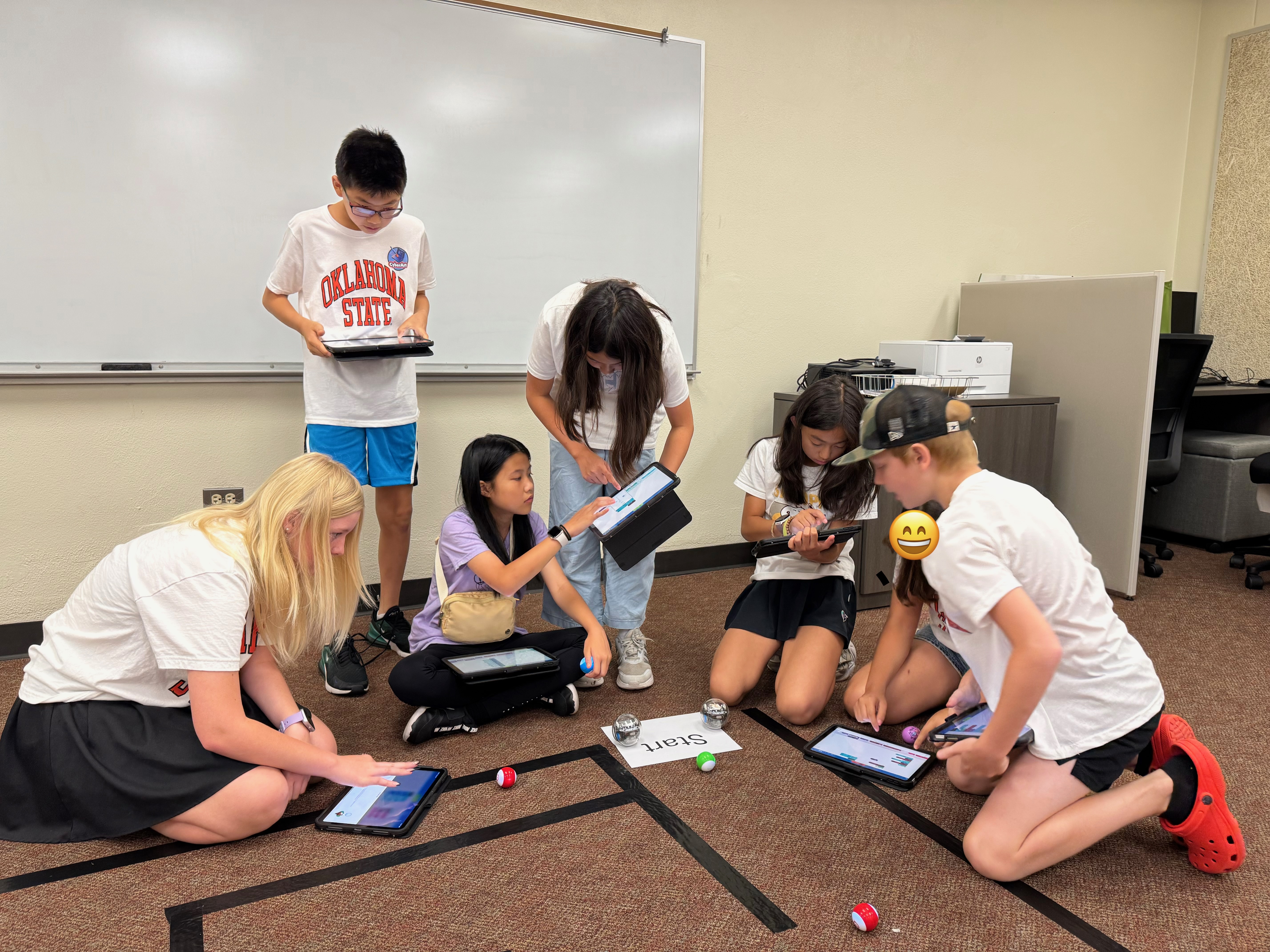 Student in a classroom actively engaged in a class activity.