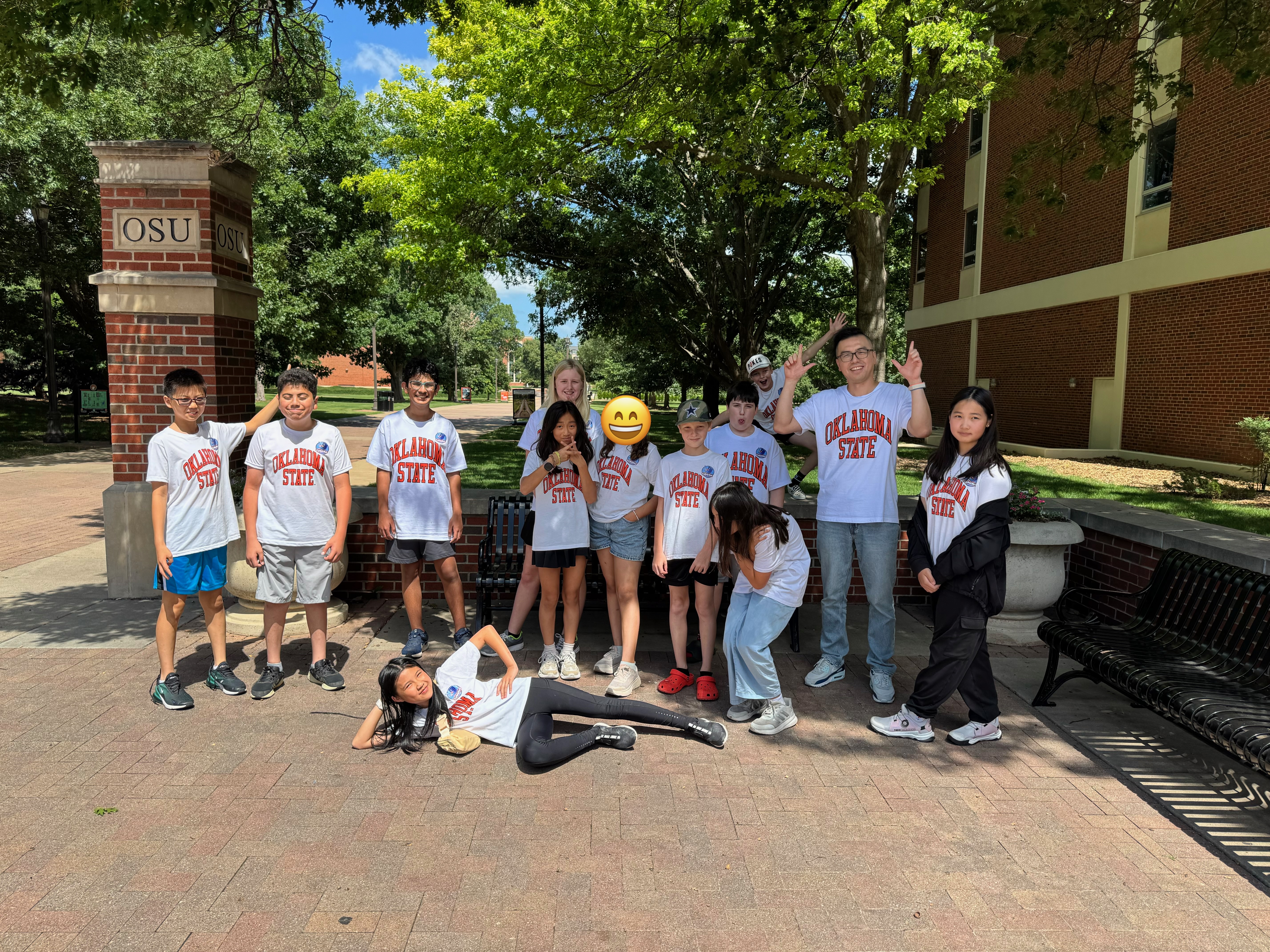 Students on a campus posing together for a photo.
