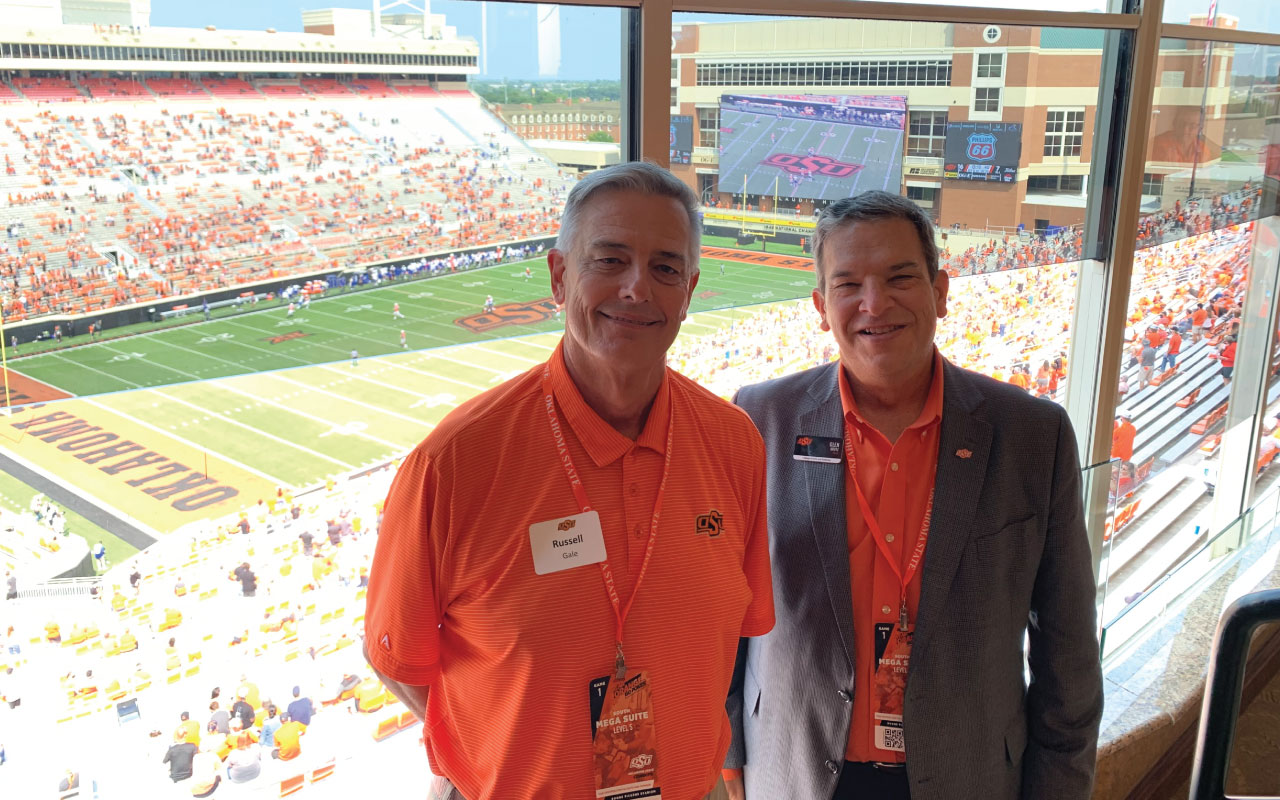 Russell Gale and Dean Krutz enjoying the football game.