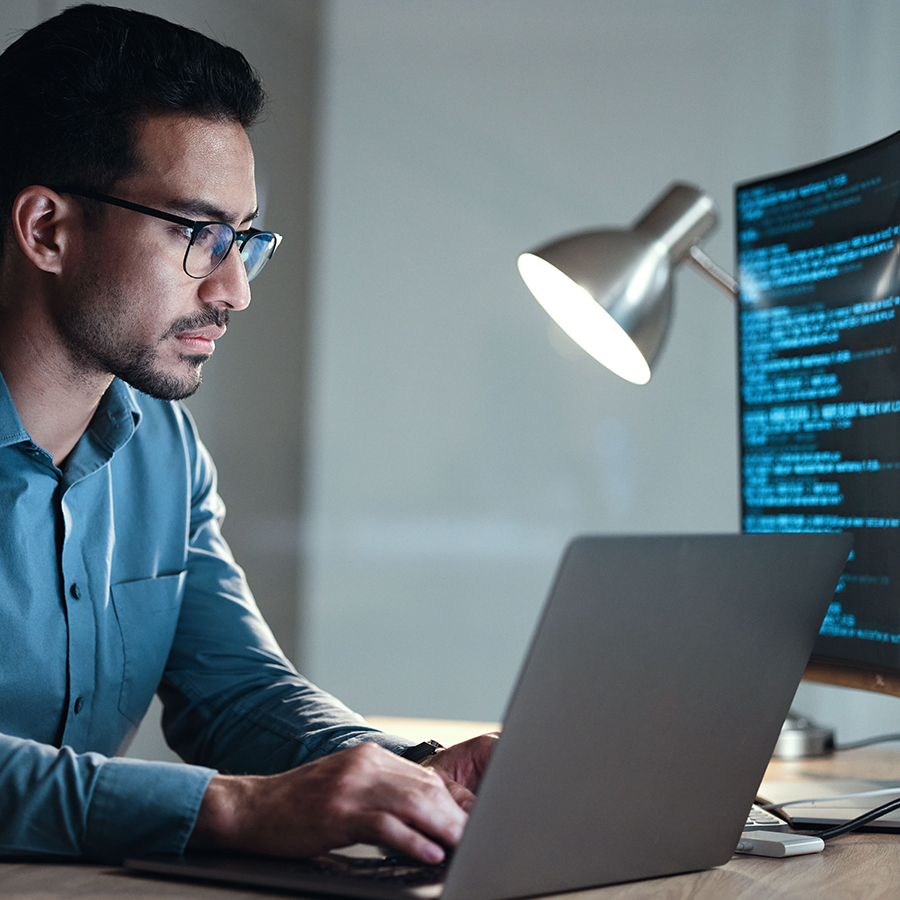 Man at computer programming