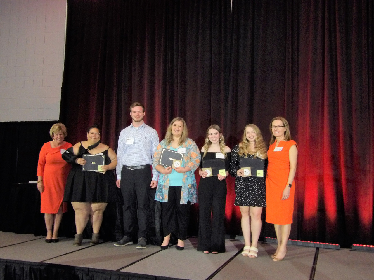 Four female and one male scholarship recipients with Mrs. Patty Walker and Dr. Camelia Knapp.