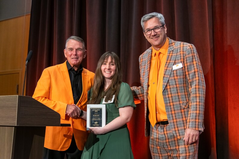 Mike Gaskins and Todd Hailhan giving the Master's Thesis Award to Autumn Graf.