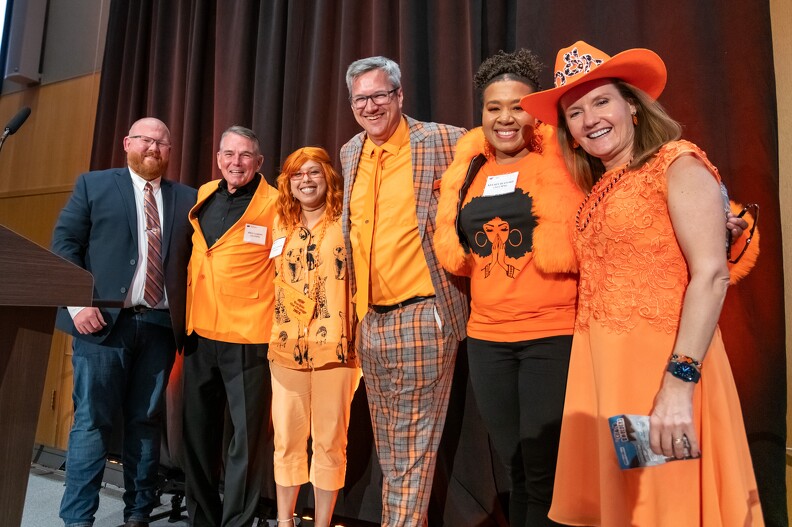 Brandon Spencer, Mike Gaskins, Monica Hinson, Todd Halihan, Kelsey Bufford and Camelia Knapp join together for the Rock The Orange Award.