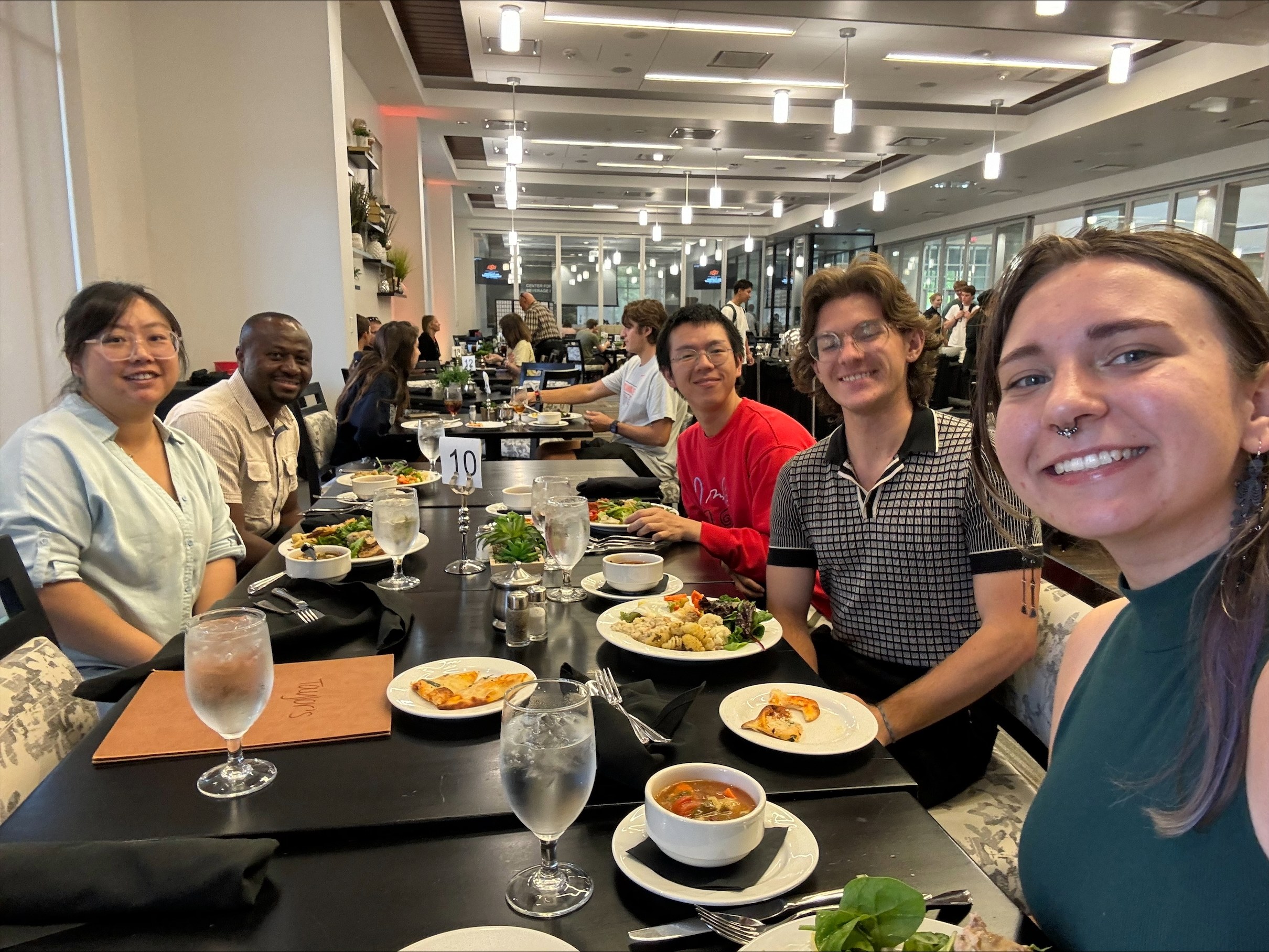 Student enjoying a meal after a conference.