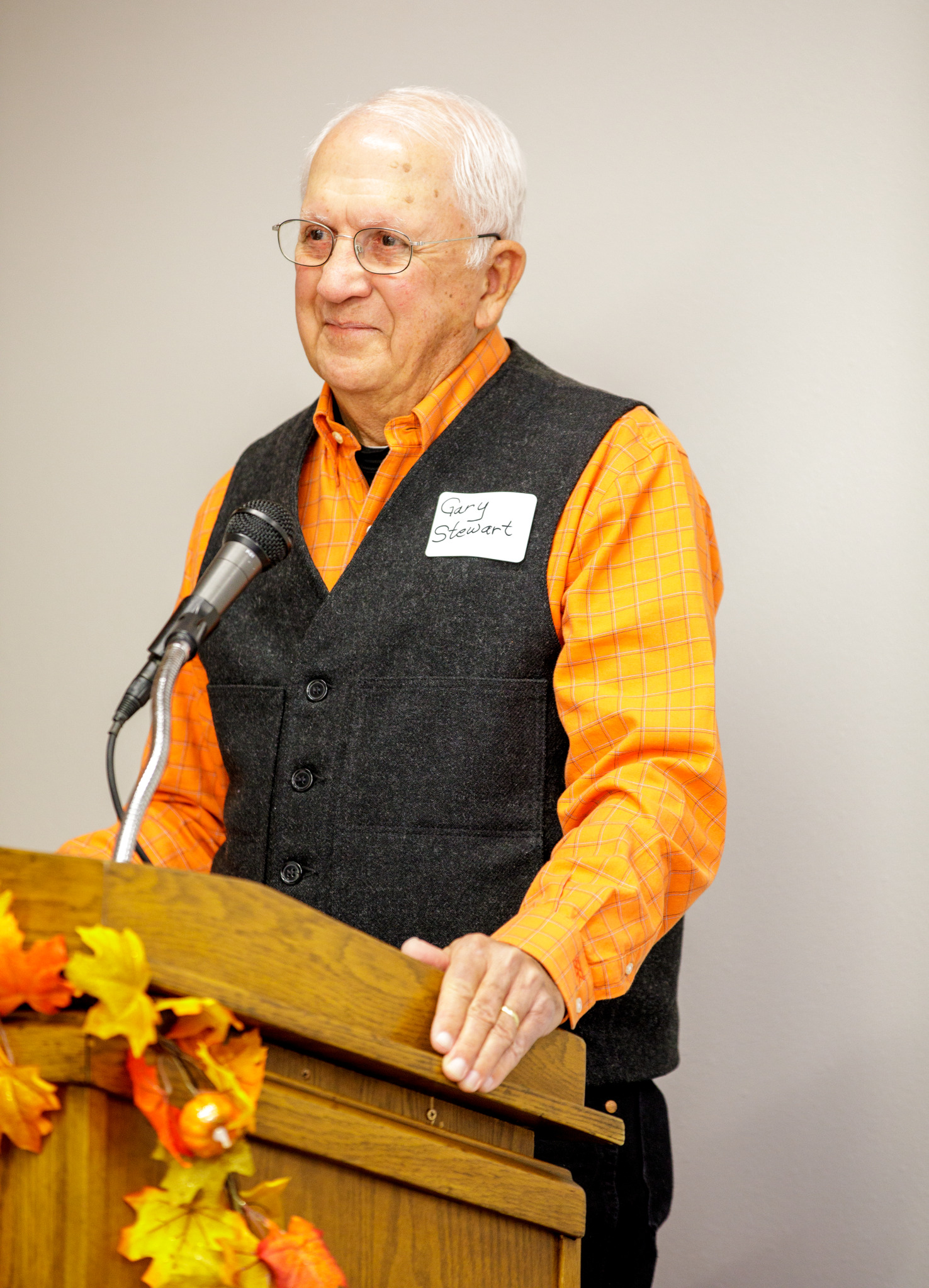 Gary stewart giving a speech at a podium.