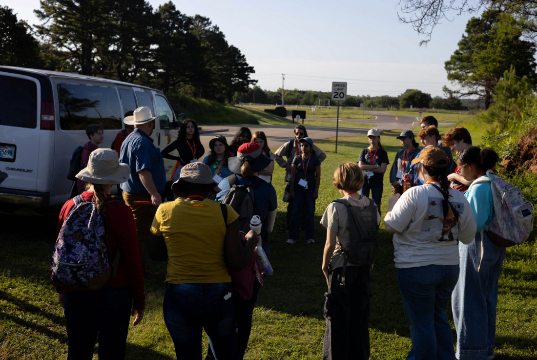 Dr. Brandon Spencer taking a group of GEO-Rex campers on a field trip.