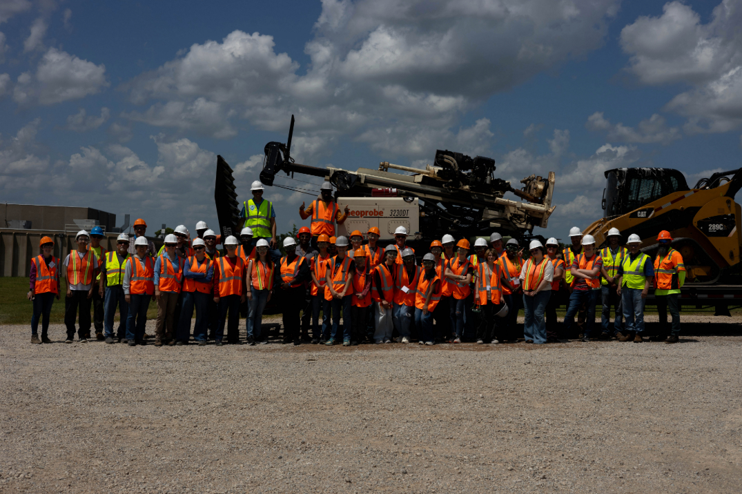 GEO-Rex campers getting a group picture with the crew that taught them to dig a well. 