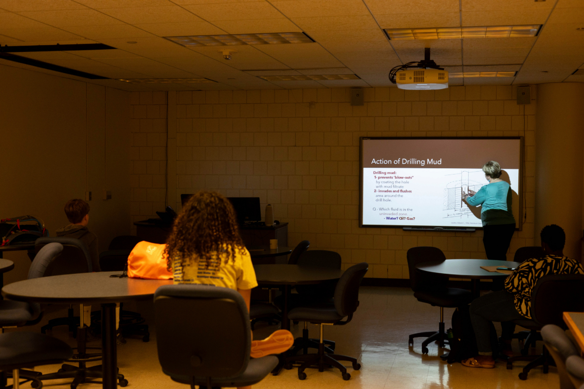 Dr. Mary Hileman teaching GEO-Rex campers about the action of drilling mud.
