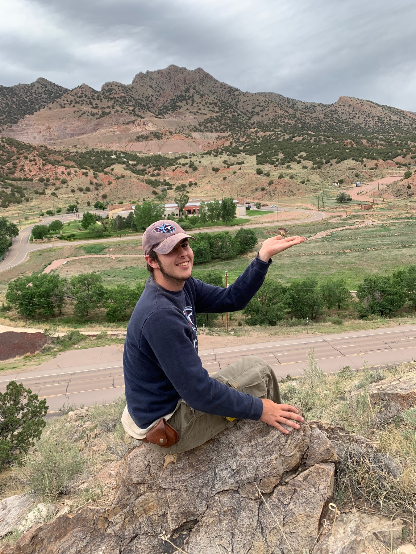 Student Jaren holding up a dinosaur statue near Skyline Drive in Cañon City. Student Jaren holding up a dinosaur statue near Skyline Drive in Cañon City.