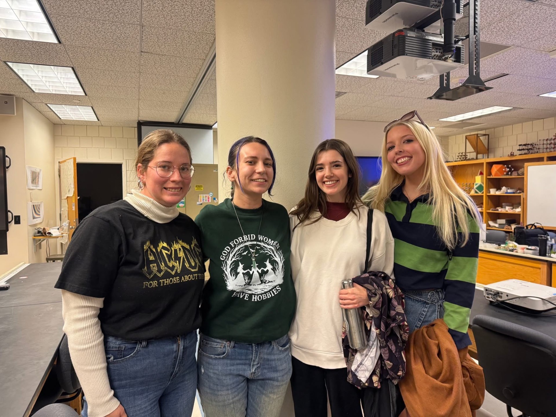 Four female students smiling on their first day in their Volcanolgy class.
