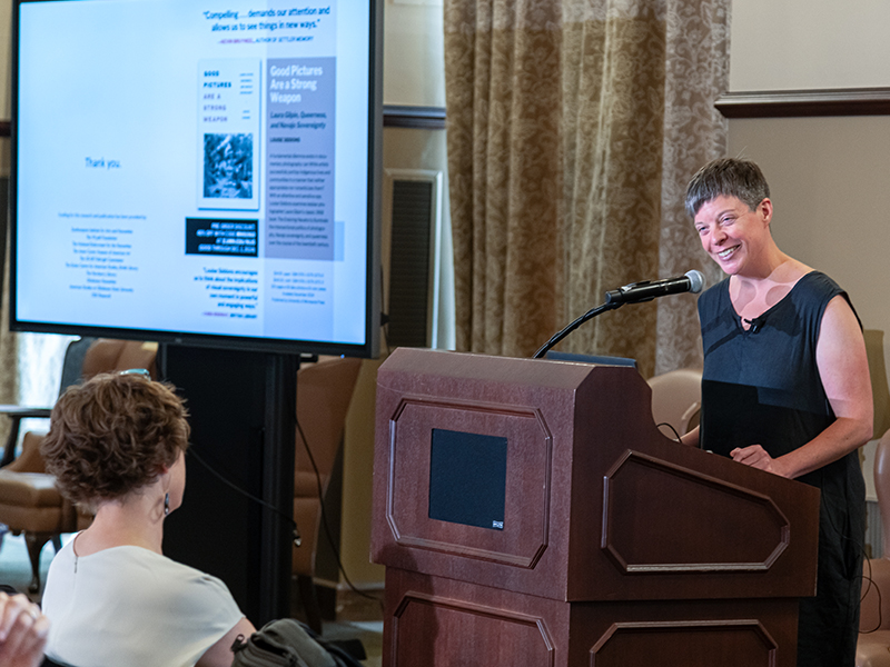 Louise Siddons presenting with a shot of slides
