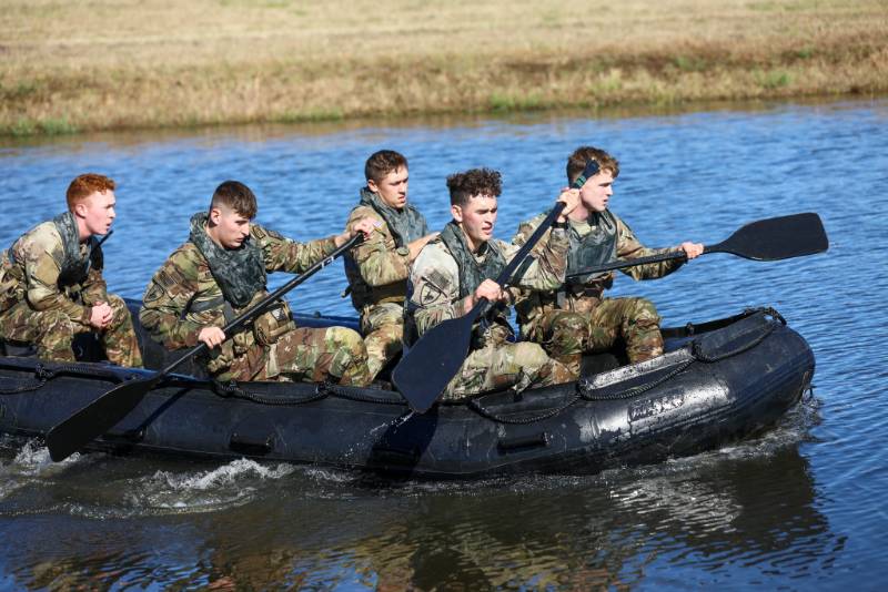 Cadets rowing a zodiac boat Cadets rowing a zodiac boat
