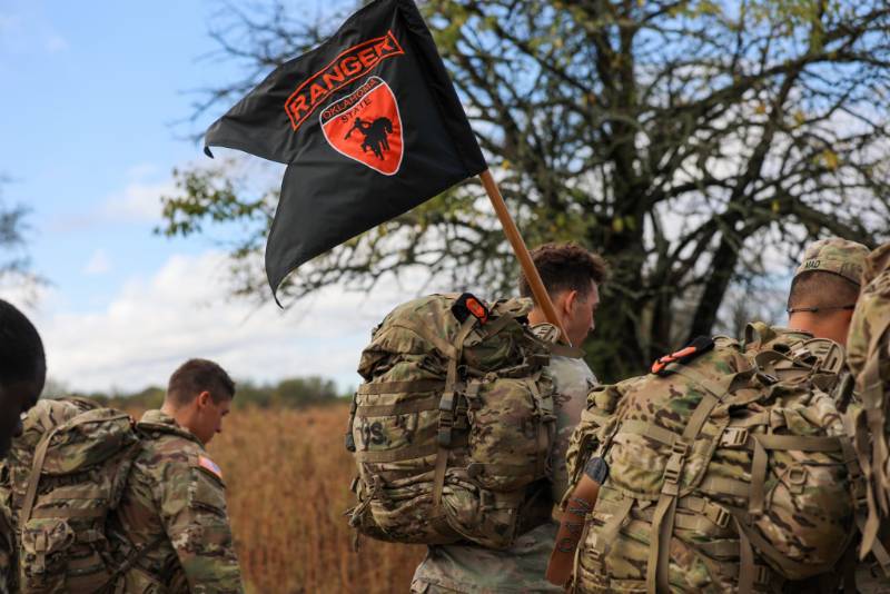 cadets carry a flag on a ruck march cadets carry a flag on a ruck march
