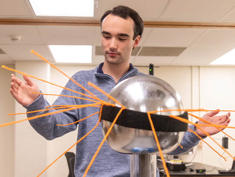 aaron_physics.jpg Student with an experiment