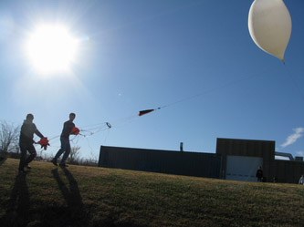 2 students doing weather balloon research 2 students doing weather balloon research