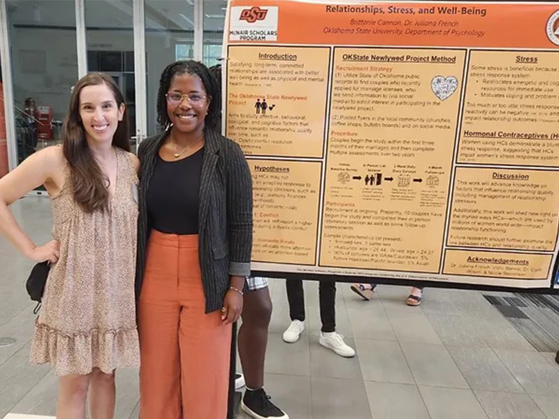Brittanie and her McNair Scholar summer research poster