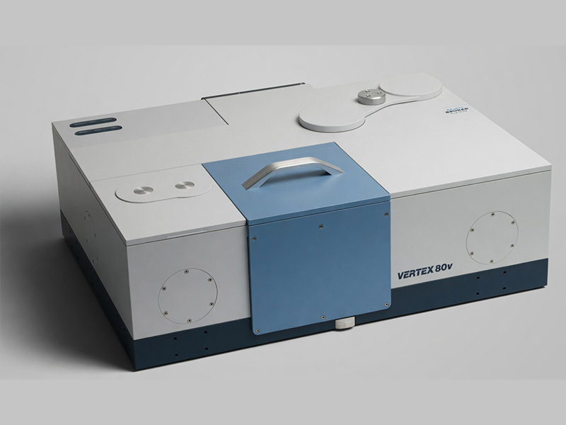 Gray laboratory instrument with a blue front panel.