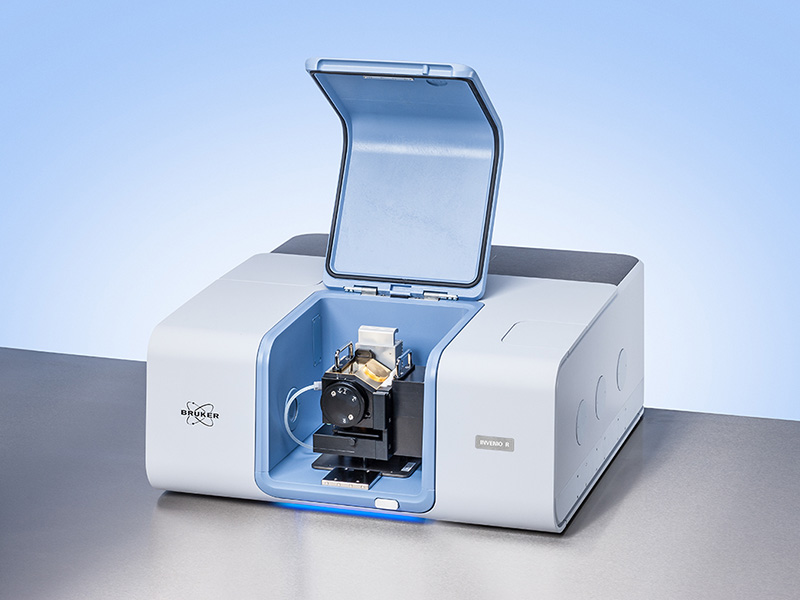 Gray laboratory instrument with a blue front panel